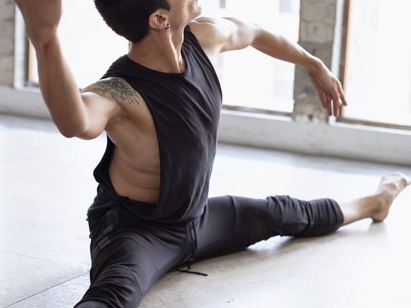 A person performing a controlled, slow movement exercise.